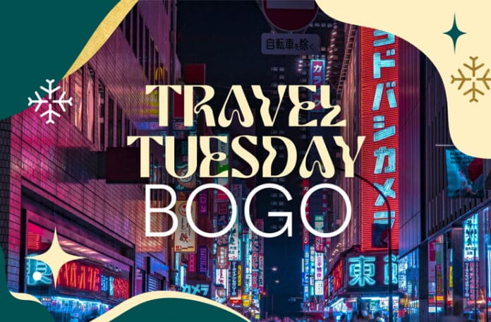 a city street with neon signs