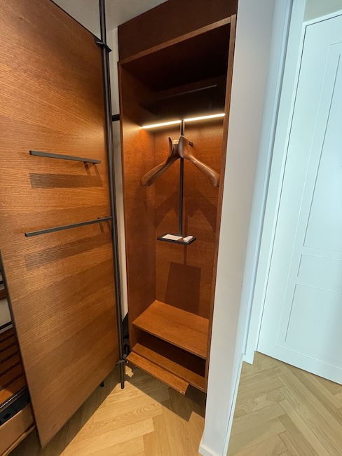 a wooden closet with a swinger