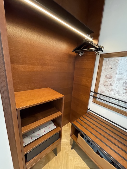 a wooden shelf with a light on it