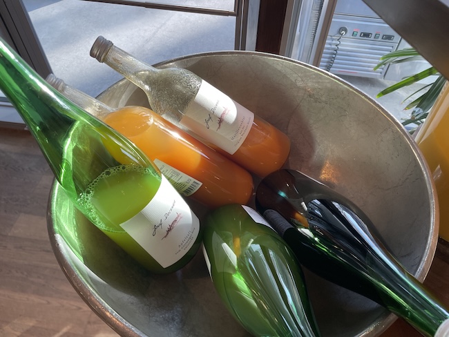 a group of bottles in a bucket