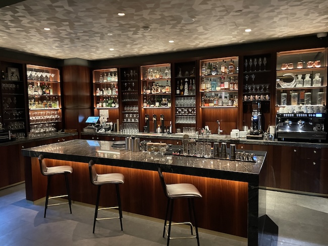 a bar with shelves of liquor and bottles