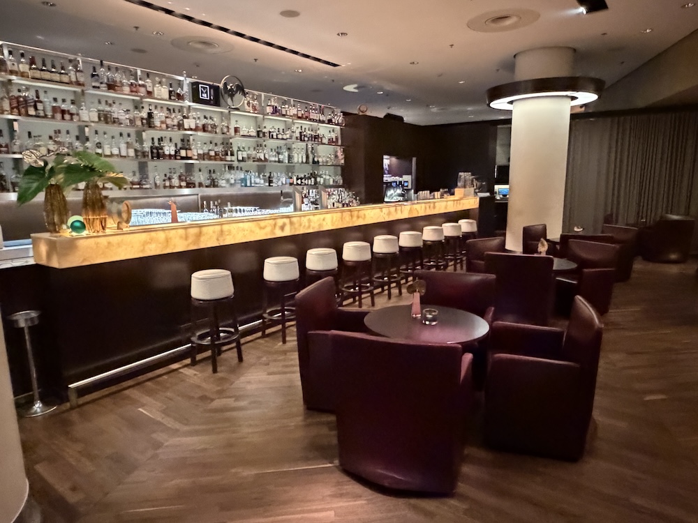 a bar with chairs and tables