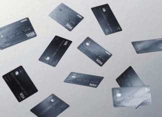 a group of credit cards flying
