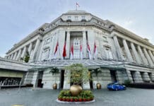 a building with flags on the front