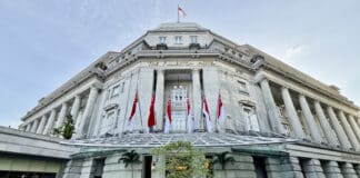 a building with flags on the front