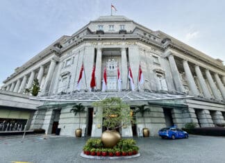 a building with flags on the front