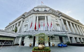 a building with flags on the front