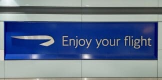Image of British Airways sign which reads "enjoy your flight".