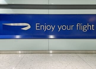 Image of British Airways sign which reads "enjoy your flight".